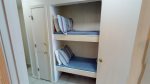 Twin bunks - suitable for kids, located in hallway across from bedroom